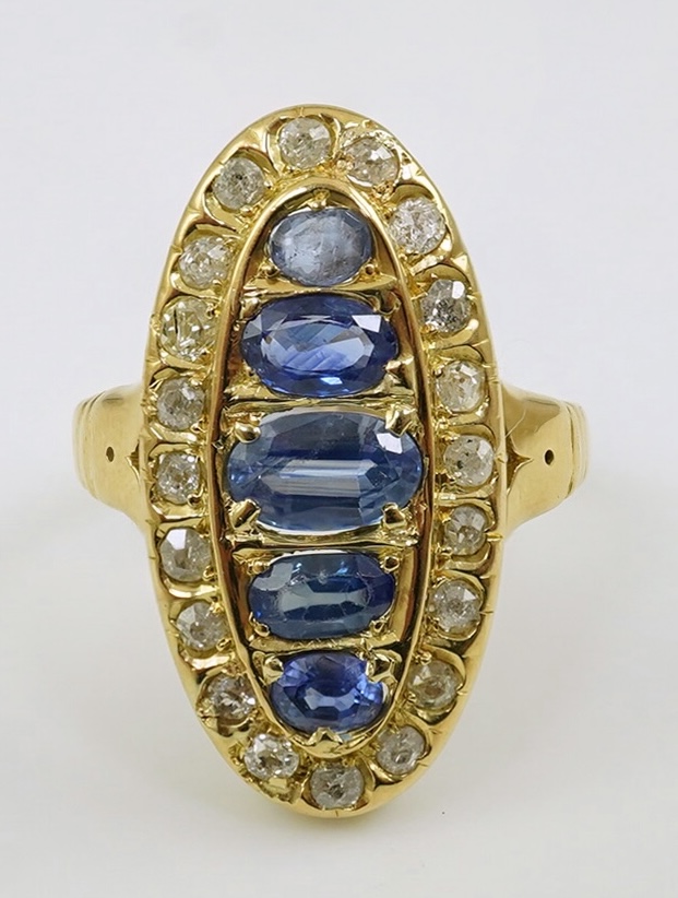 A late Victorian 18ct gold sapphire and diamond set oval cluster ring